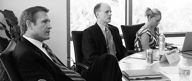Telecommunications executives met at the office of City National Bank to discuss the need to stay current amidst technology overload.