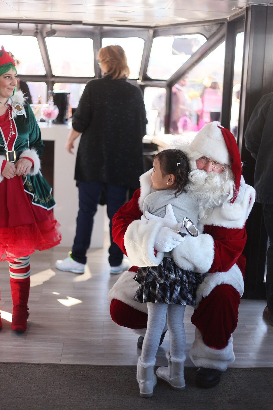 Santa Claus takes a break during his busiest time of year and returns to the Lake Las Vegas community to cruise on the lake with children.
