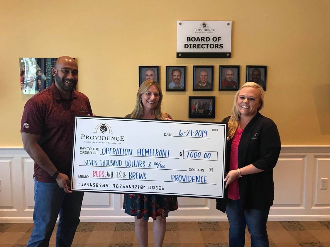Pictured from (L-R) Larry Hartman,  CCMC Providence community manager; Michelle Hagge, Operation Homefront; Jenna Mooney, CCMC Providence Lifestyle Director