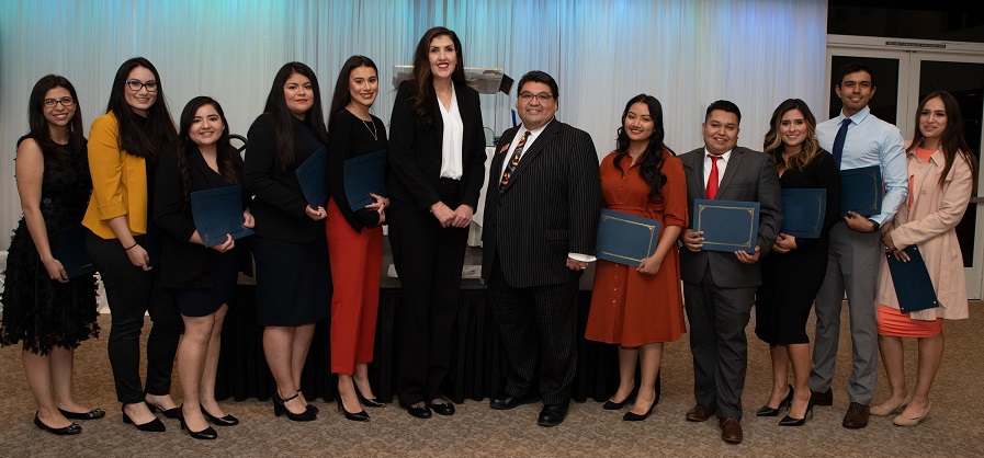 Las Vegas Latino Bar Association Board of Directors members Claudia Aguayo and Romeo Perez, center, are pictured with nine of 17 recipients of their 2019 ¡Andale! Scholarship. The scholarship can be used to cover LSAT preparation course and exam fees.