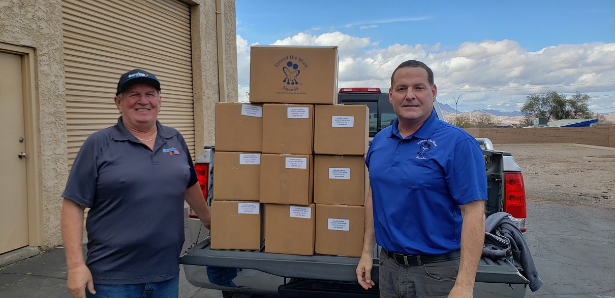 From Right - Dale Darcas, Serving Our Kids executive director, and Ron Rovacchi, Spread the Word Nevada warehouse manager