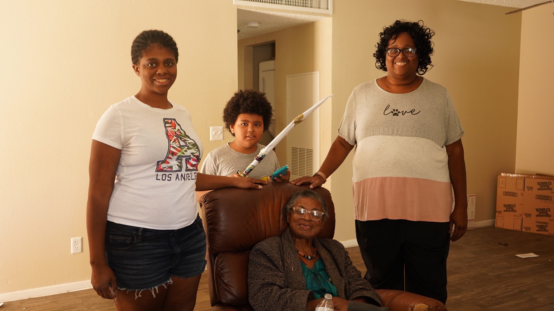 Tyria Smith and her family- recipents of a Move 4 Less Moving Our Community move sm