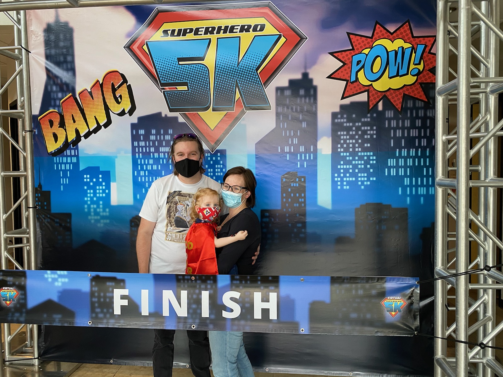 Riley of Team Riley the Radiant with family at a celebratory finish line-072f5889