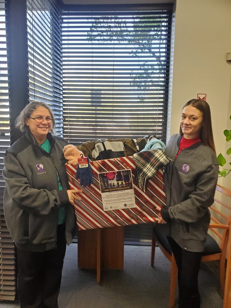 Destiny Hartman and Toni Cornett organize donations for a clothing drive