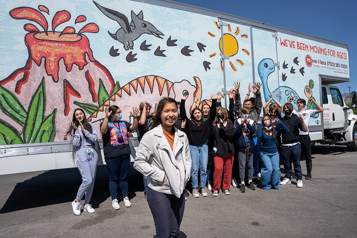 Hannah Vuong and her WCTA classmates in front of the Move 4 Less truck she designed.M4L_Design a Truck Reveal_029 - SM-adf4ecd4