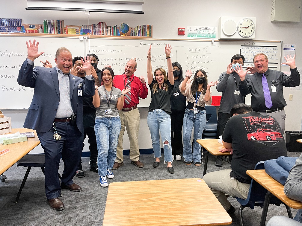 sm IMG_5487 - Canyon Springs HS staff and students and M4L's Maggie Kolesar celebrate Martin Vece (red shirt), Teacher Appreciation winner from Move 4 Less-63c1f456