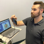 Dr. Robey demonstrating IMI equip