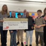 GSR general manager Shannon Keel presents $15,000 check to Robert Mitchell Elementary School students alongside GSR executive assistant Anita Thomas.