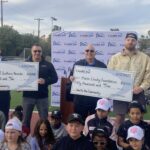 One For the Community 2025 Check Presentation